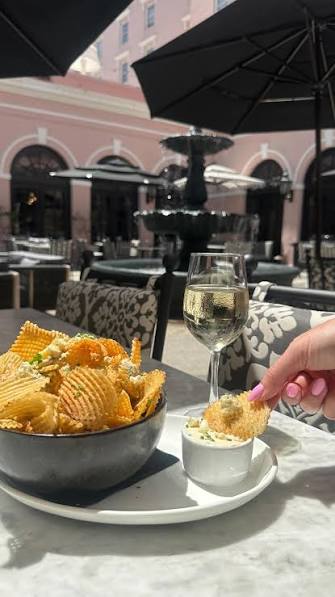 Iron Rose signature dishes Old Bay Kettle Chips
Braised Pork Belly
Joyce Farms Chicken